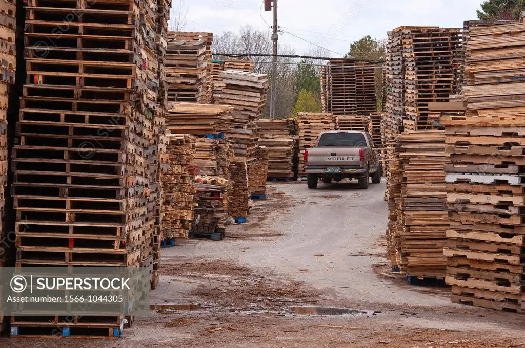 Pickup truck parked amid stacked pallets in Michigan, USA