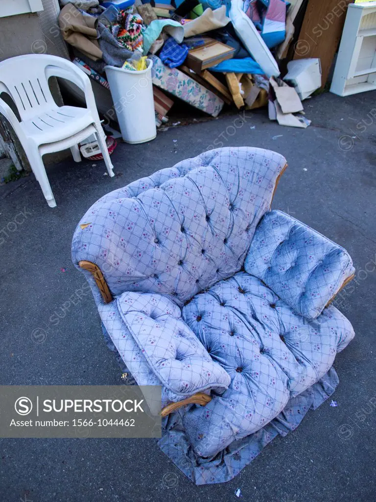 A cushy chair sits outside a foreclosed house in Milbury, Masachussetts, United States