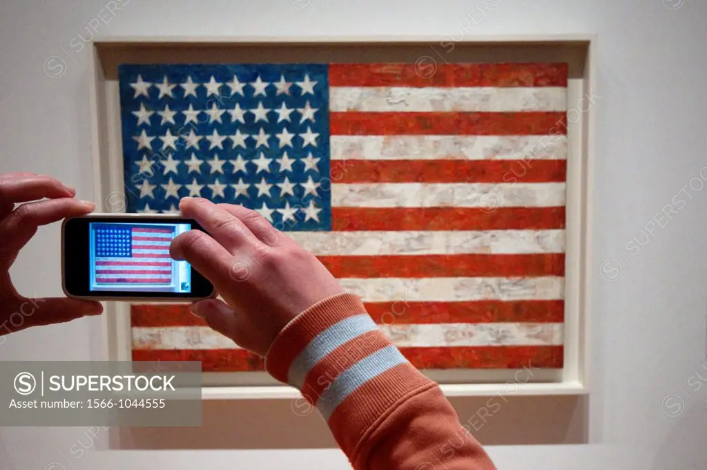 USA, New York, New York City, Manhattan, Museum of Modern Art, MOMA, Woman Taking Picture Using an iPhone, Flag By Jasper Johns