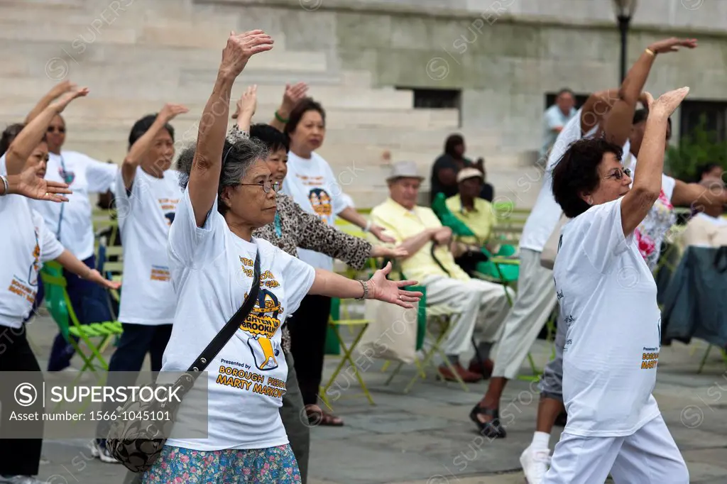 Senior citizens participate in a restorative movement class taught by a member of the Mark Morris Dance Company at Borough Hall in Brooklyn in New Yor...