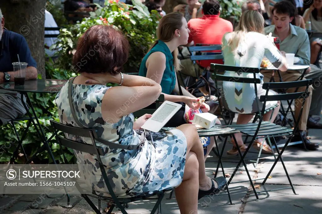A reader uses her Amazon Kindle electronic book in Bryant Park in New York