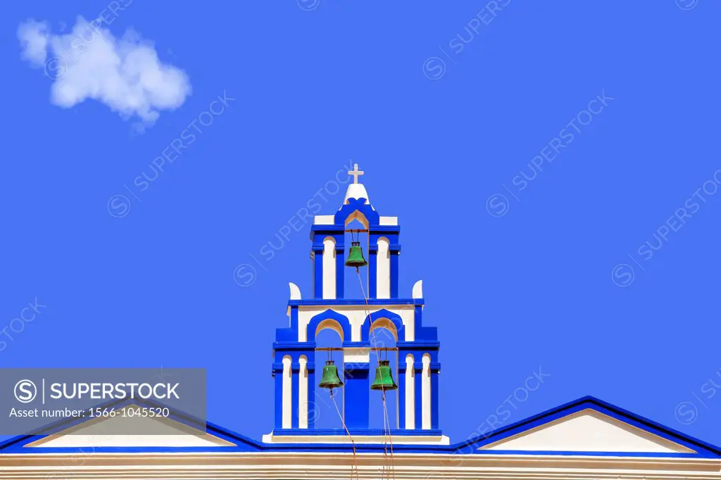 The bell tower of a church photographed against the sky