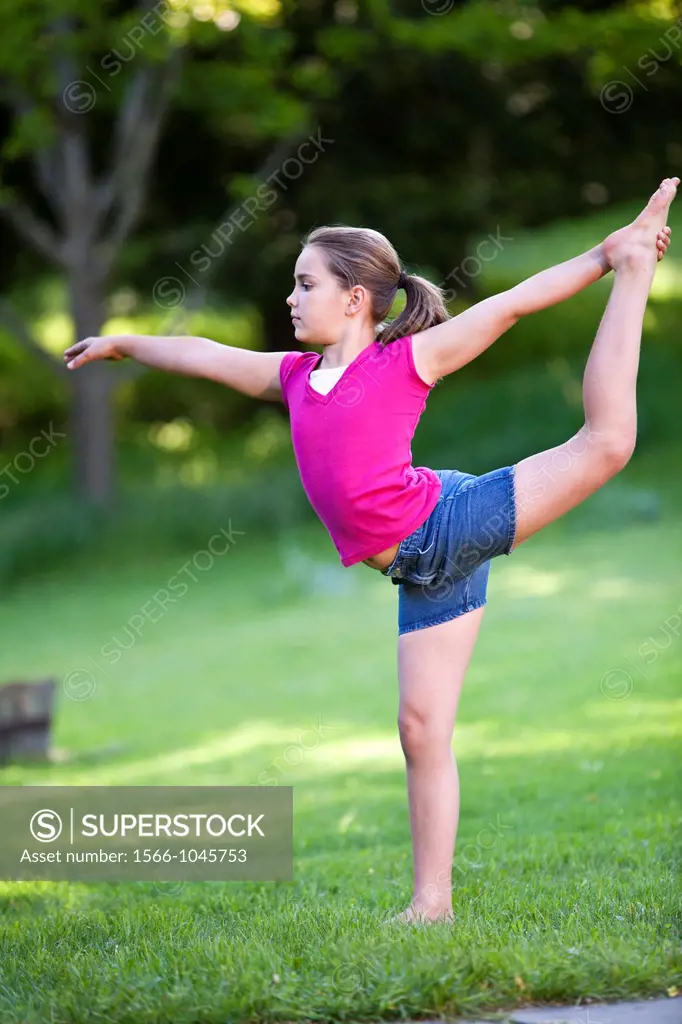 young girl practicing gymnastic routine