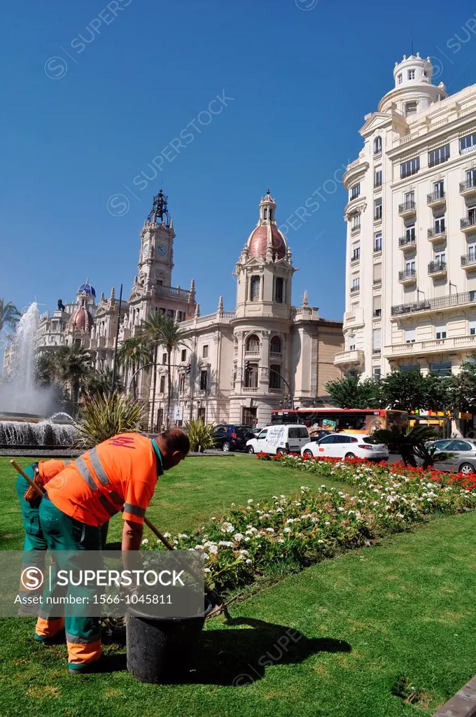 Valencia, Spain: gardeners at work in Plaza del Ayuntamiento