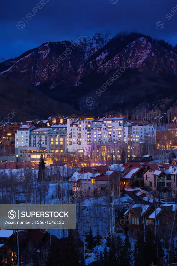 USA, Colorado, Telluride, elevated view of Mountain Village Ski Area and The Peaks Resort, dusk