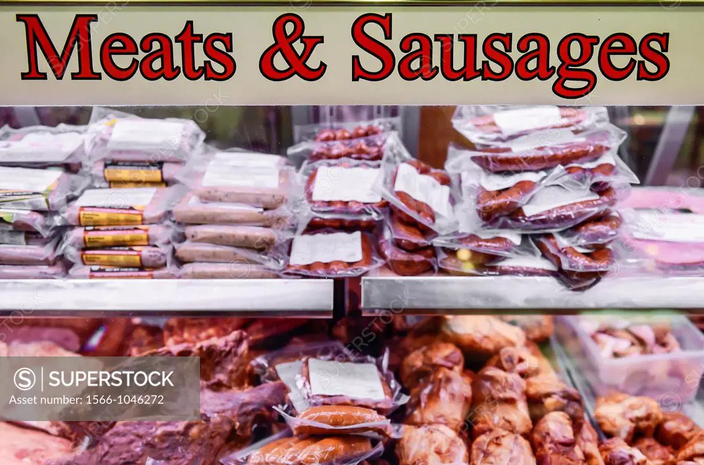 Meat and sausage display at butcher shop.