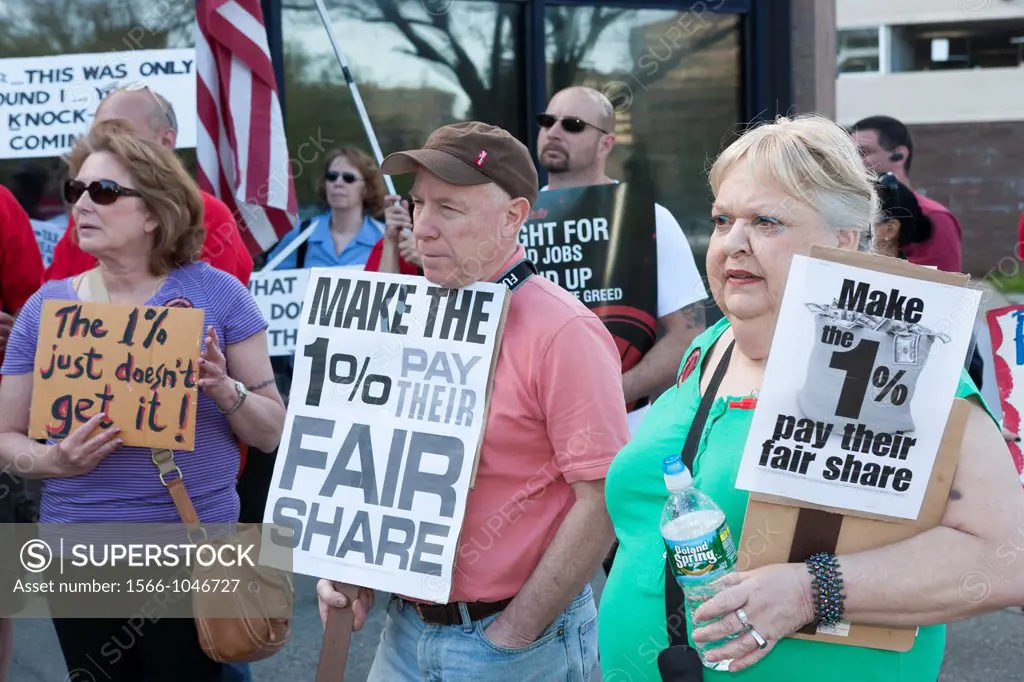 Members of the Communications Workers of America CWA Local 1103 and MoveOn participate in the Tax the 1 protest at the post office in White Plains, Ne...