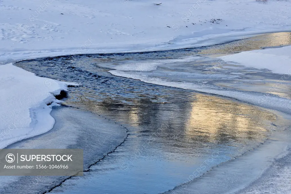 Lamar river with snow drifts in late winter, Yellowstone NP, Wyoming, USA