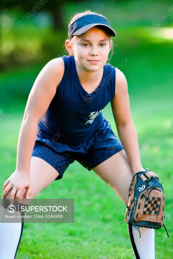 Young softball player ready to catch ball