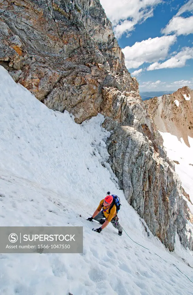 climbing The June Couloir on the North Face of Williams Peak high above the Sawtooth Valley in the Sawtooth Mountains near the town of Stanley in cent...