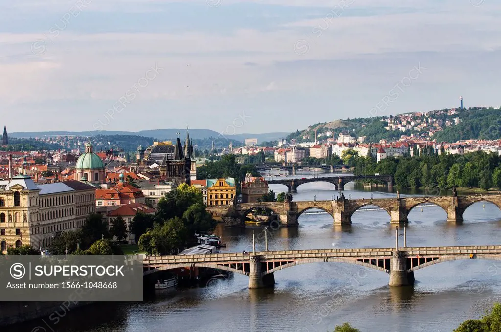 A beautiful view of the Vltava river and the old bridges and buildings in Prague