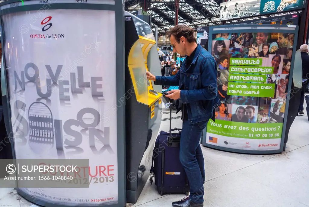 Paris, France, Tourist Traveling in Train Station, Man Buying Train Ticket at Vending Machine, in Gare de Lyon,