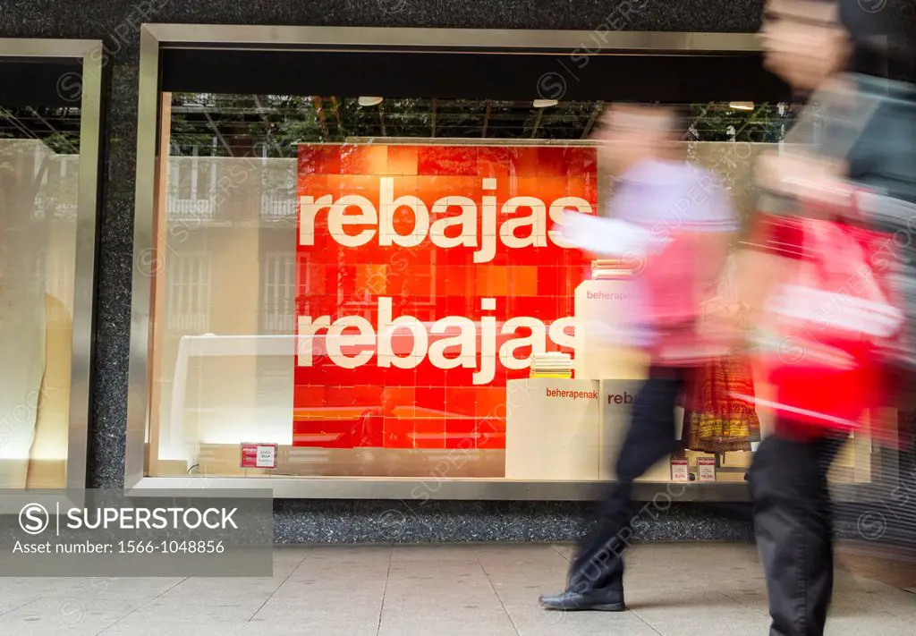 Sales sign in Spanish Rebajas and Basque beherapenak in Corte Ingles store window in Bilbao, Basque country, Spain, Europe