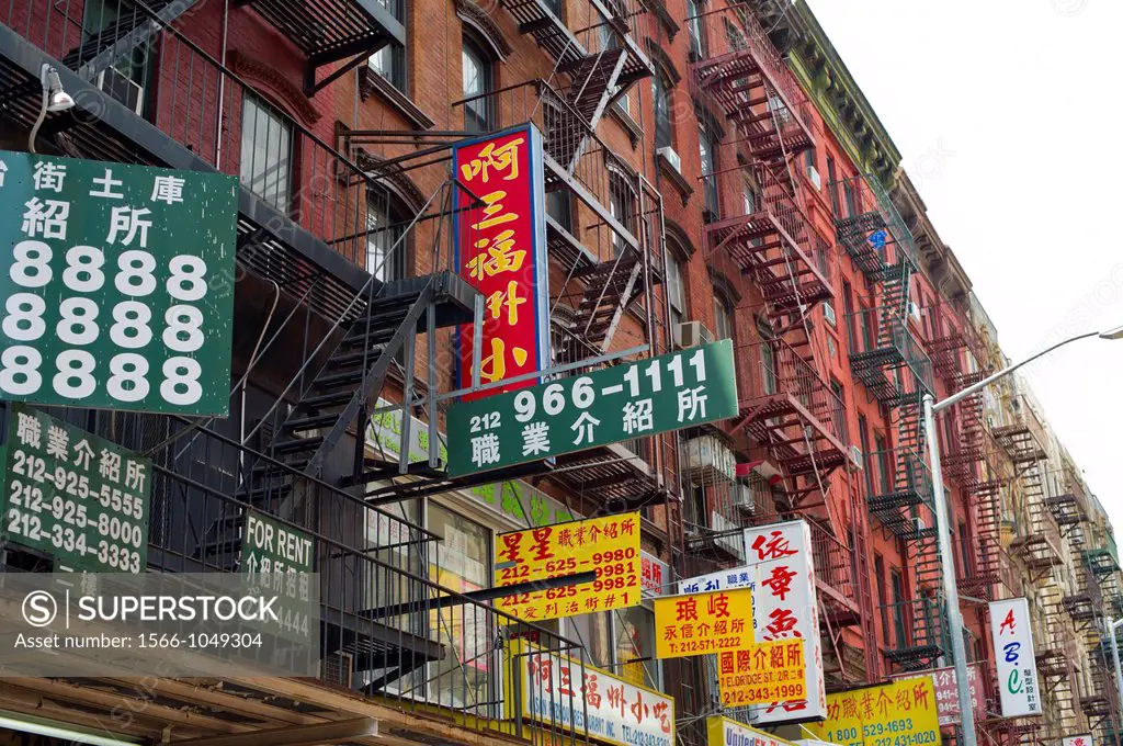 Street signs on Eldridge Street in Chinatown during the ´Egg Rolls and Egg Creams´ street fair in New York The popular fairs celebrates the diversity ...