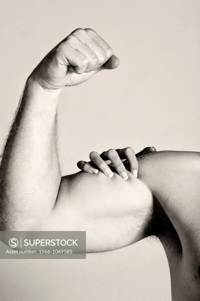 Man´s arm with female hand