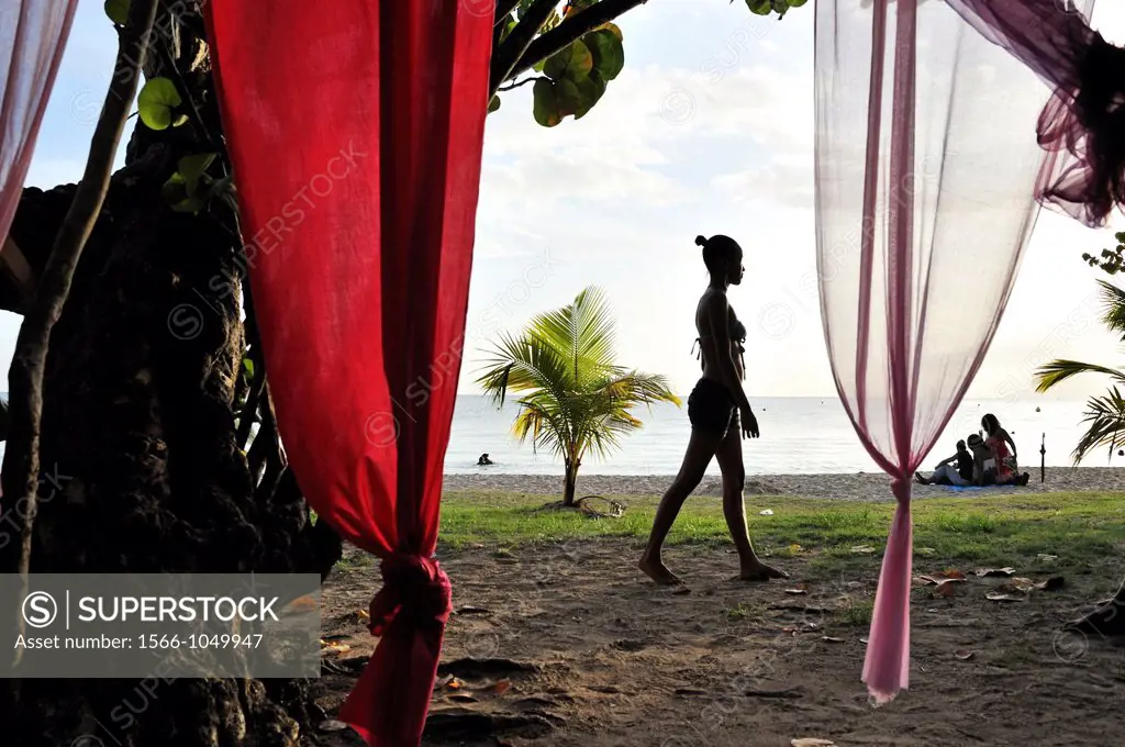 young woman on the beach, Sainte-Anne Bay, Martinique, french island overseas region and department in the Lesser Antilles in the eastern Caribbean Se...