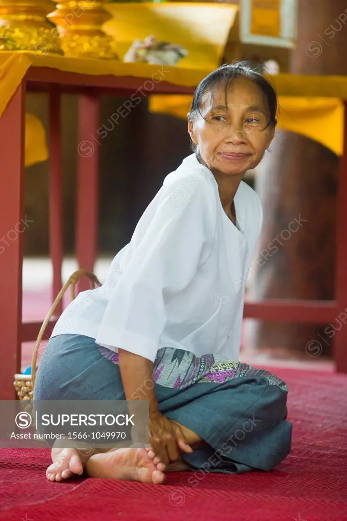 Woman in a temple  Thailand