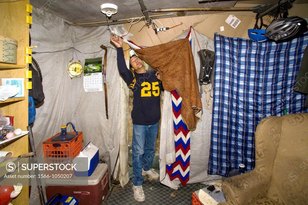 A military veteran enters his makeshift shelter among homeless residents of a primitive outdoor encampment in the desert town of Victorville, CA  Note...