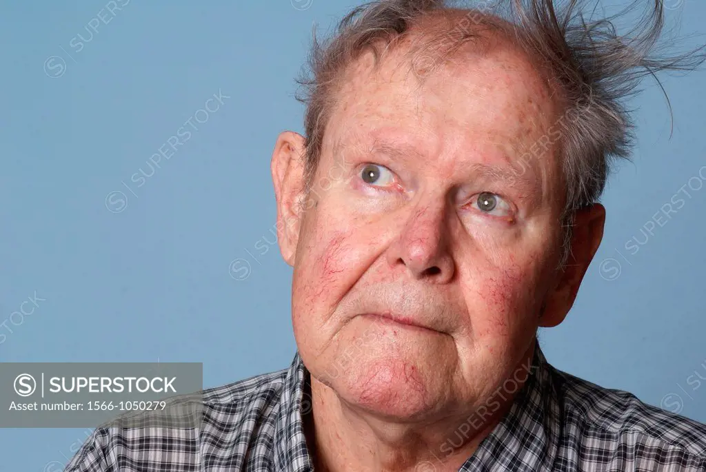 Elderly man with messy hair