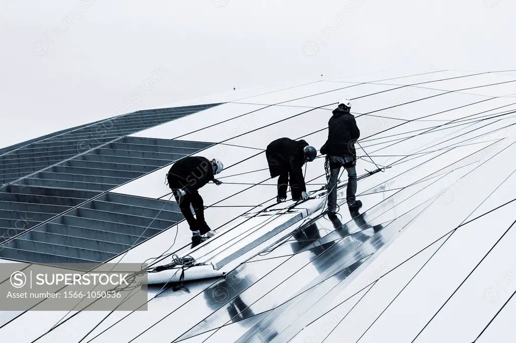 Workmen on roof of The Sage concert hall in Gateshead, Tyne & Wear, England, United Kingdom