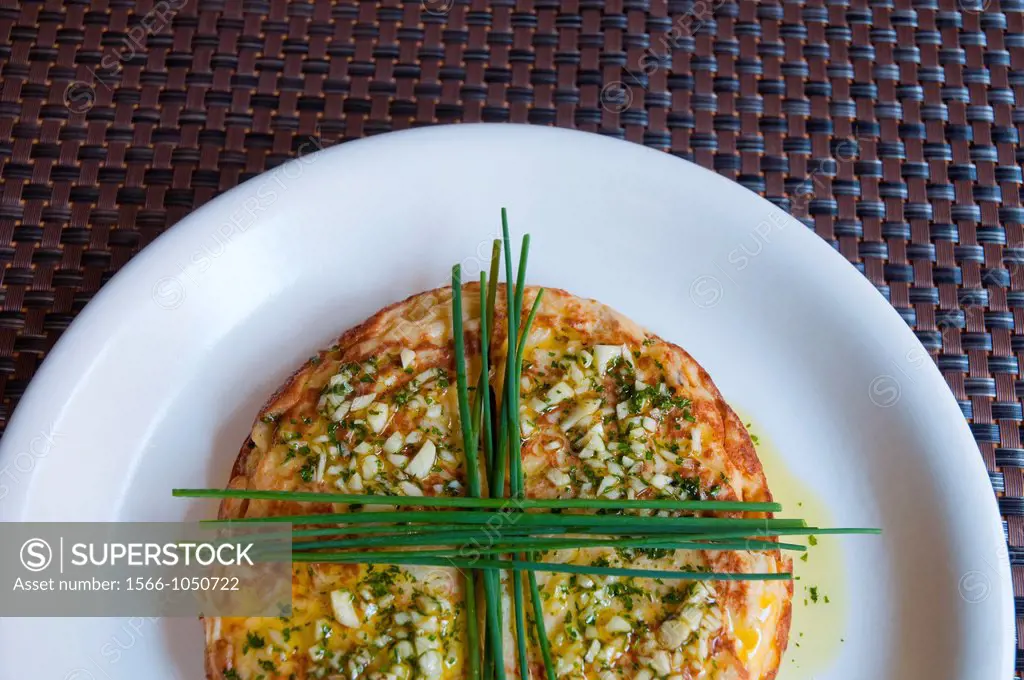 Spanish omelet with garlic, parsley and spring onion