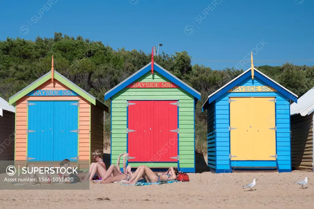 Relaxing at the bathing boxes on Brighton Beach, Port Phillip Bay, Melbourne