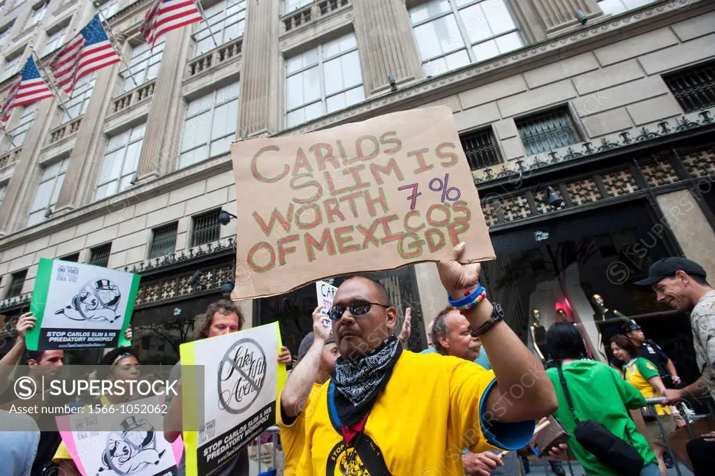 Immigrant rights groups join members of Occupy Wall Street and their supporters to protest against Mexican billionaire Carlos Slim in front of Saks Fi...