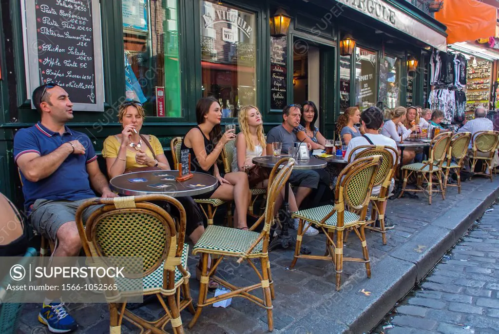Paris, France, Young Adults Sharing Drinks in French Café Bistro in Montmartre Area