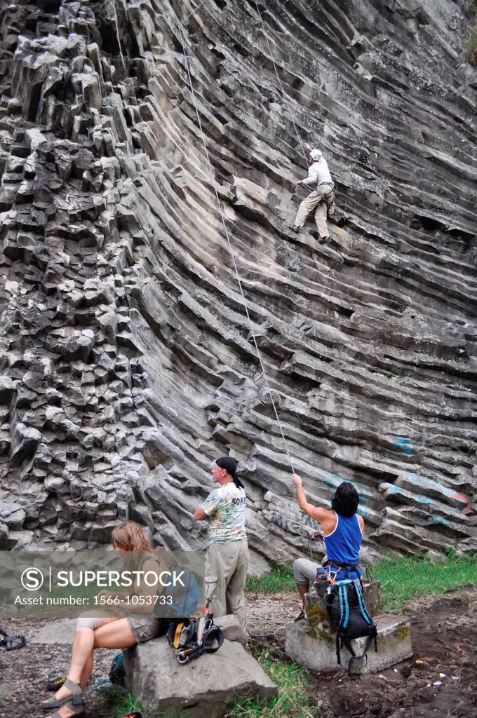 near Boquete Panama: a foreign tourist climbing a rock