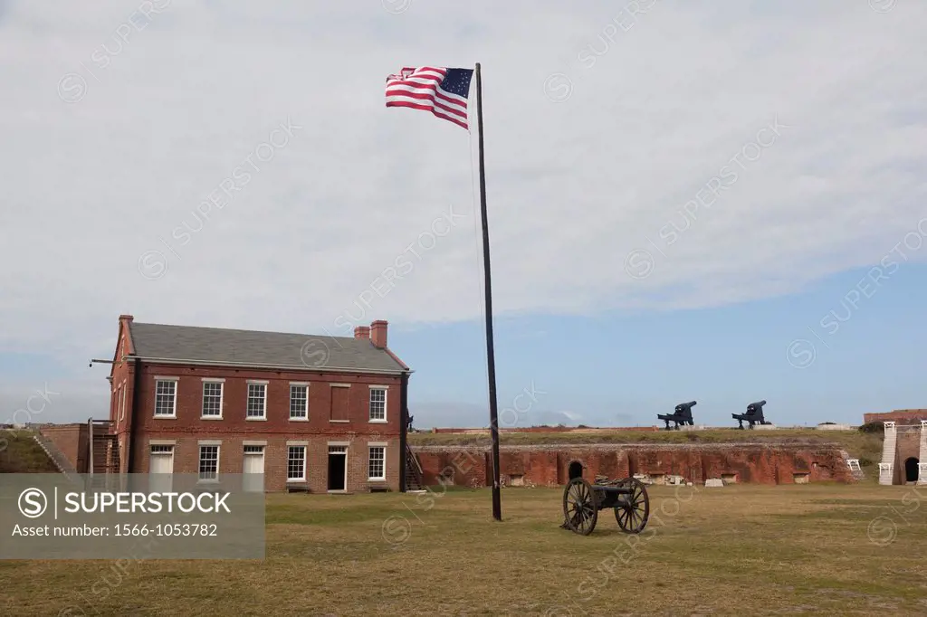 Barracks, canon and flag at Ft  Clinch, Florida
