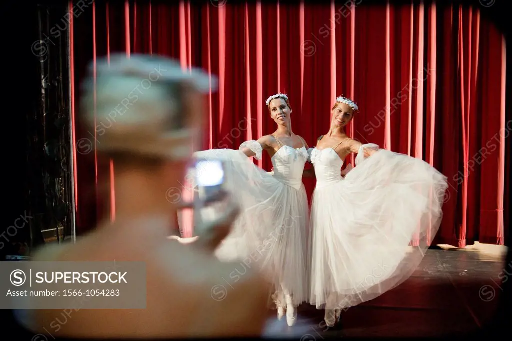 Classical ballet dancers on the stage, posing for a photo,