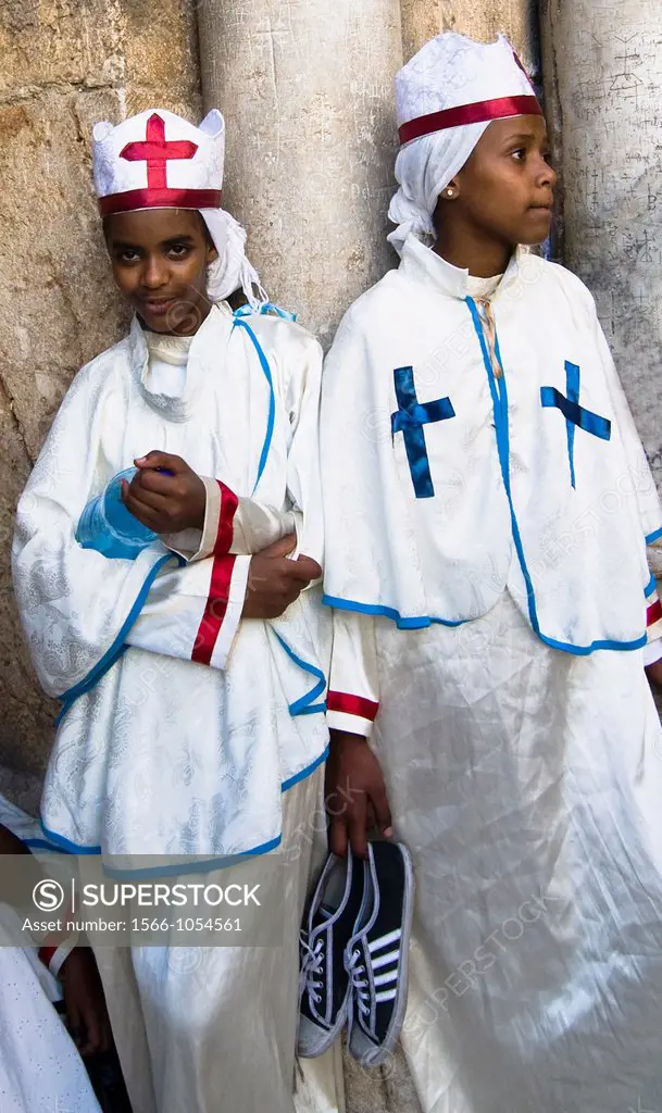 Eritrean orthodox nuns standing by the main gate of the Church of the holy Sepulcher