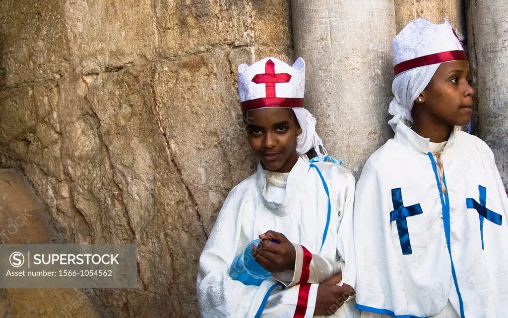 Eritrean orthodox nuns standing by the main gate of the Church of the holy Sepulcher