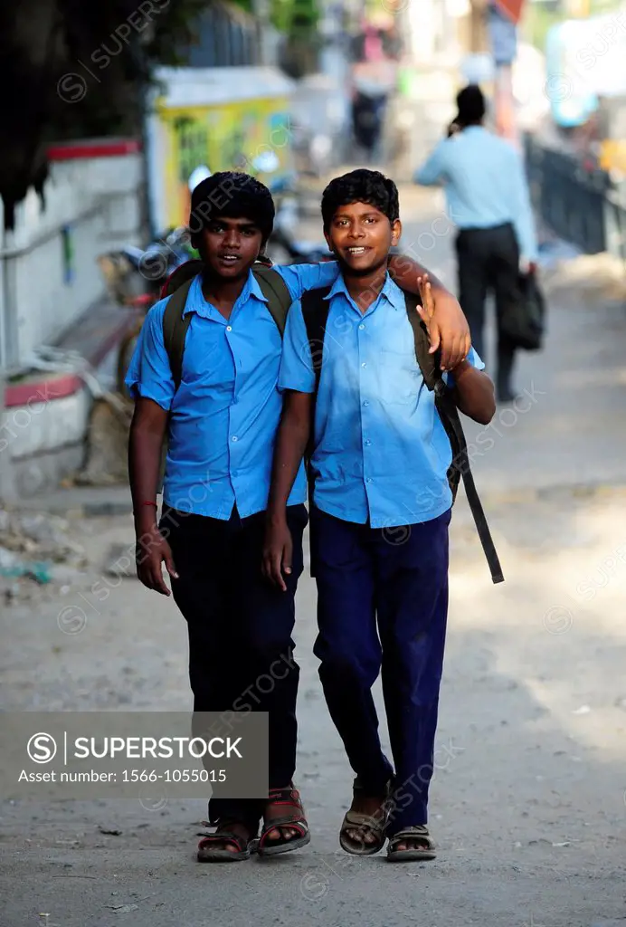 Two schoolboys in a street of Puducherry Pondicherry,Tamil Nadu,South India,India,Asia