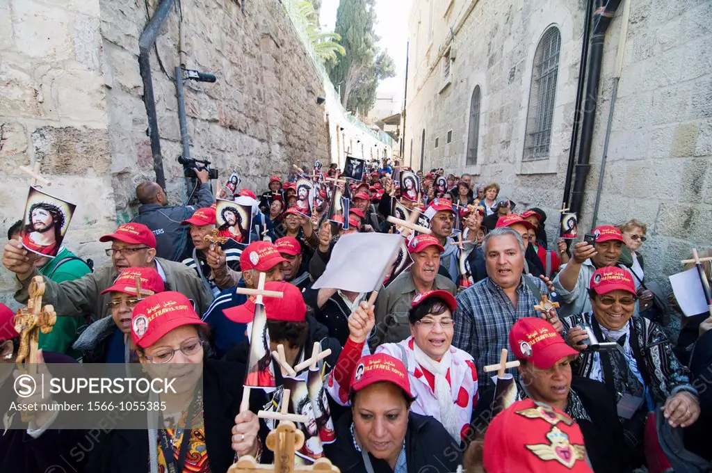 Coptic Egyptian pilgrims walking in a procession through the Via Dolorosa during the Good Friday festival in Jerusalem