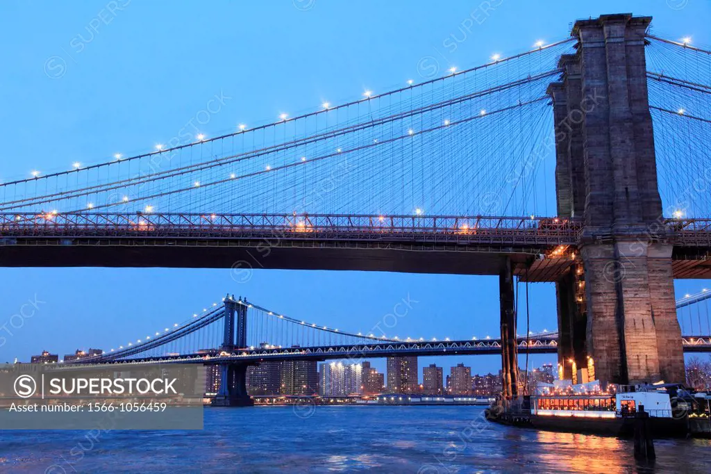 The night view of Brooklyn Bridge with Manhattan Bridge in the background from Brooklyn Bridge Park  New York City  New York  USA.