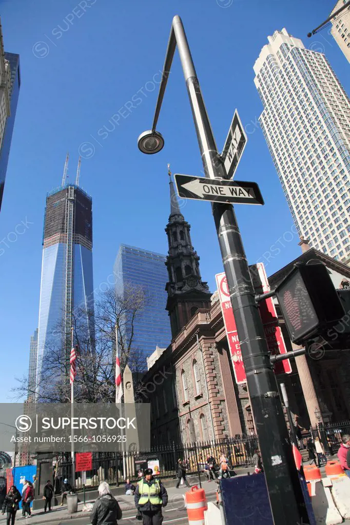 The view of One World Trade Center formerly known as the Freedom Tower under construction in the new World Trade Center complex from Fulton Street wit...