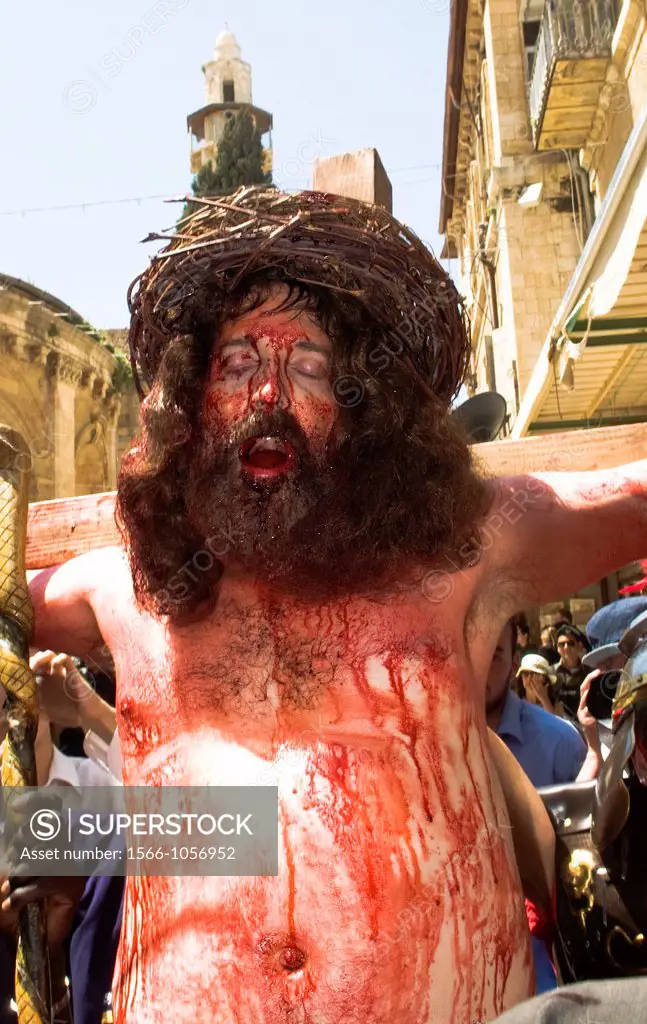 ´Jesus´ being crucified in the Via Dolorosa in the old city of Jerusalem  A group of American pilgrims re live the Crucifiction events during the Good...