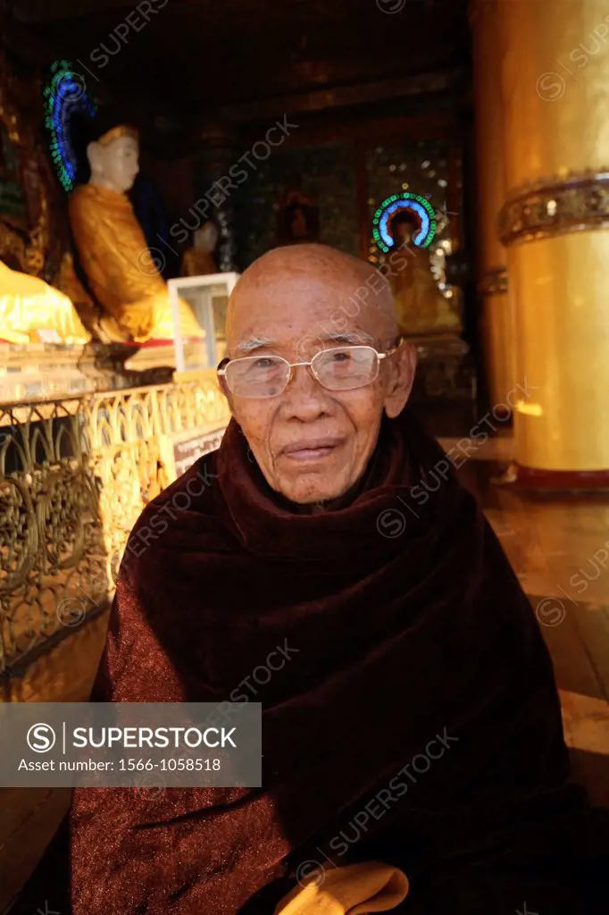 Old monk in Shwedagon pagoda in Rangoon, Myanmar