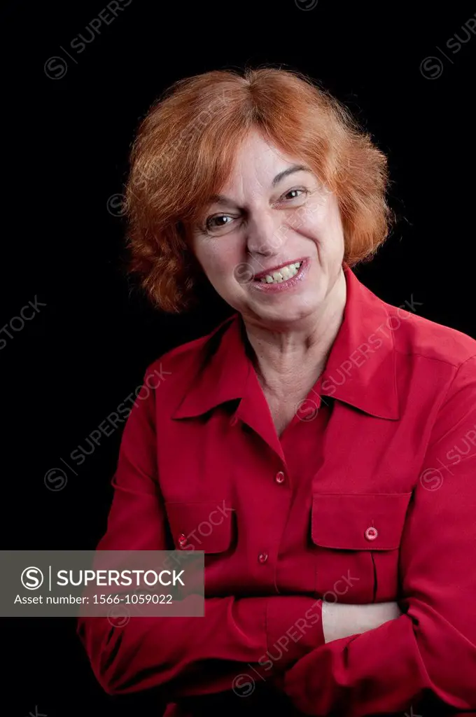 Middle aged woman looking falsly friendly