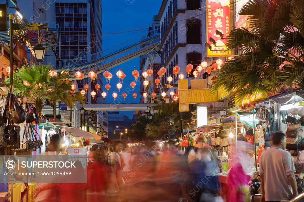Lanterns hang over open marketplace on Jalan Lekir alongside Jalan Petaling in Chinatown, Kuala Lumpur, Malaysia