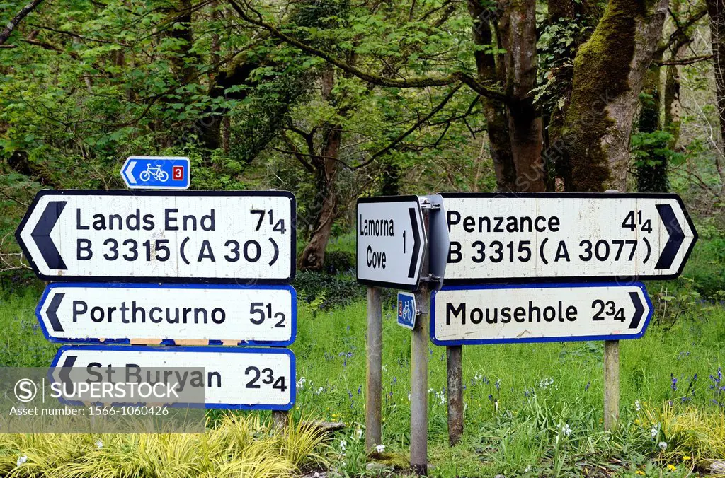 a roadsign showing disatances to villages in cornwall, england, uk