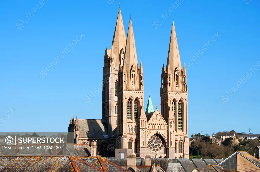 the spires of the cathedral tower above the houses in the cornish city of truro, cornwall, uk
