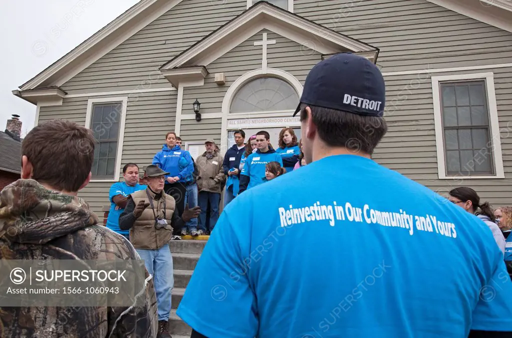 Detroit, Michigan - Dennis Nordmoe, executive director of the nonprofit Urban Neighborhood Initiatives, gives directions to volunteers from Chrysler C...
