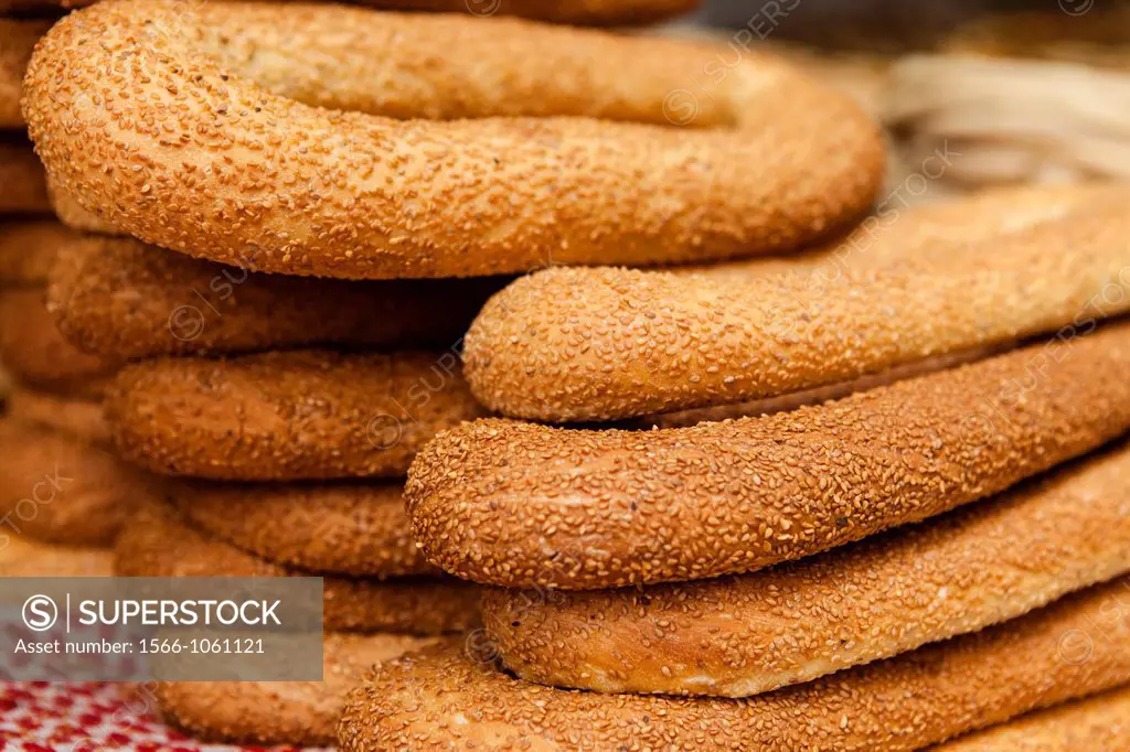 Fresh baked sesame cover bagels for sale on food carts in the old city of Jerusalem by street vendors  