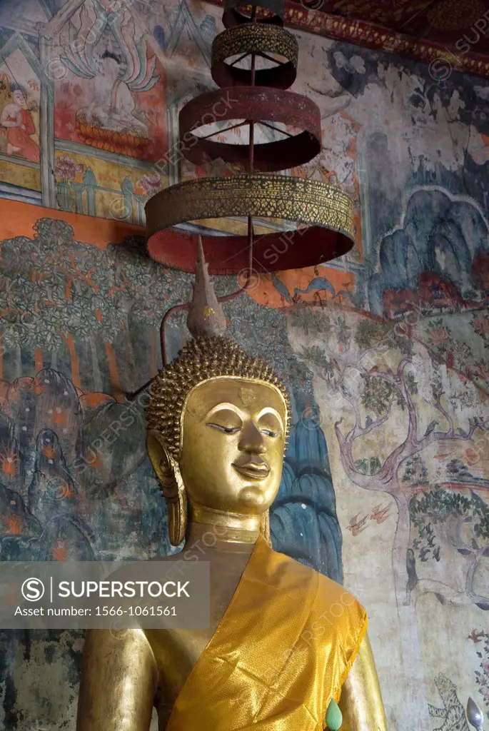 Sitting Buddha statue and murals in background, Wat Pa Hoauk, Luang Prabang, Laos