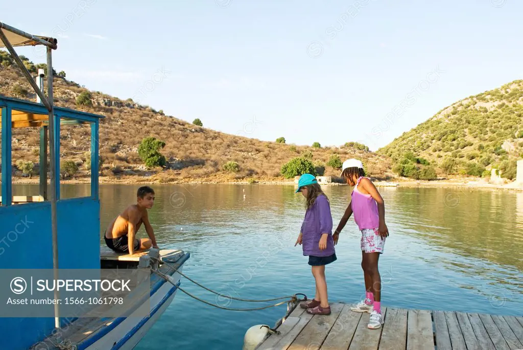 little girls on a footbridge in a creek of the Fethiye´s bay, Lycian coast, Turkey, Eurasia