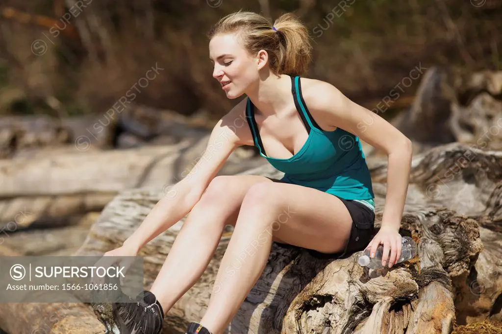 Caucasian young woman checking her injury after exercise