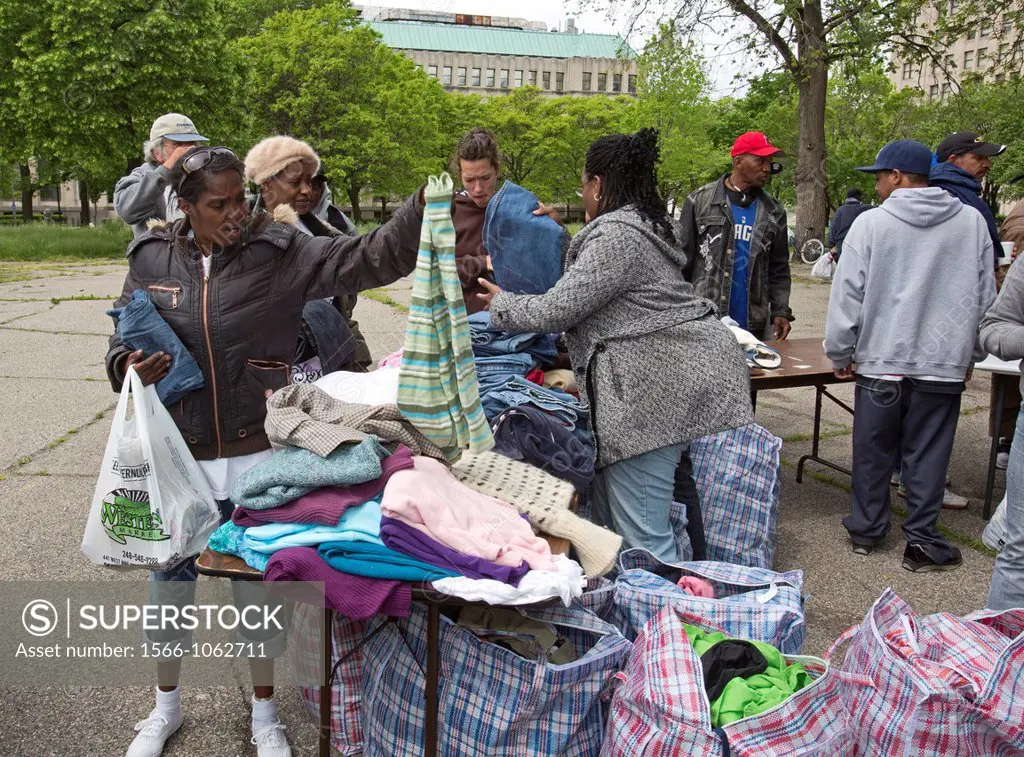 Detroit, Michigan - Volunteers from United Christians in Christ church distribute clothing to homeless people in Cass Park