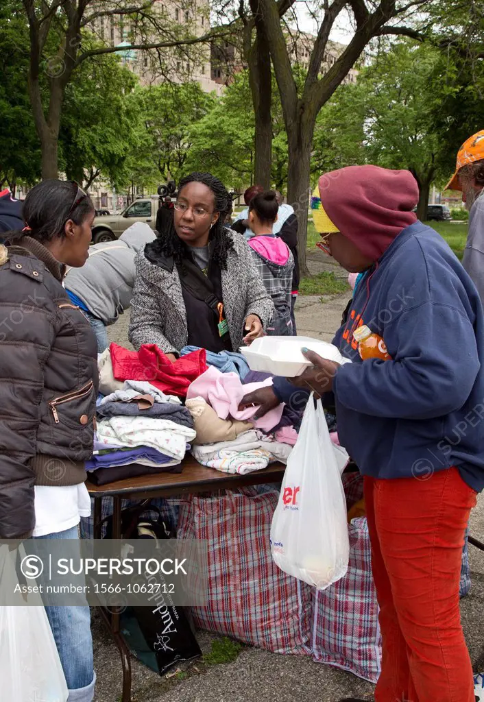 Detroit, Michigan - Volunteers from United Christians in Christ church distribute clothing to homeless people in Cass Park